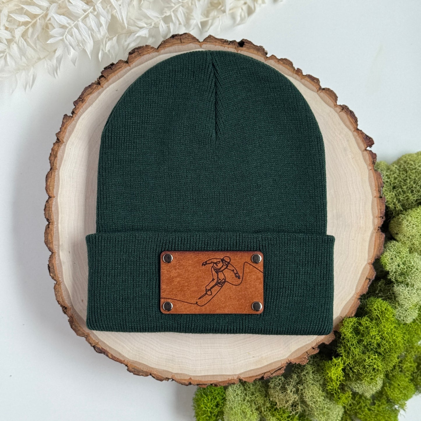 Snowboarder beanie with snap on/off leather patch