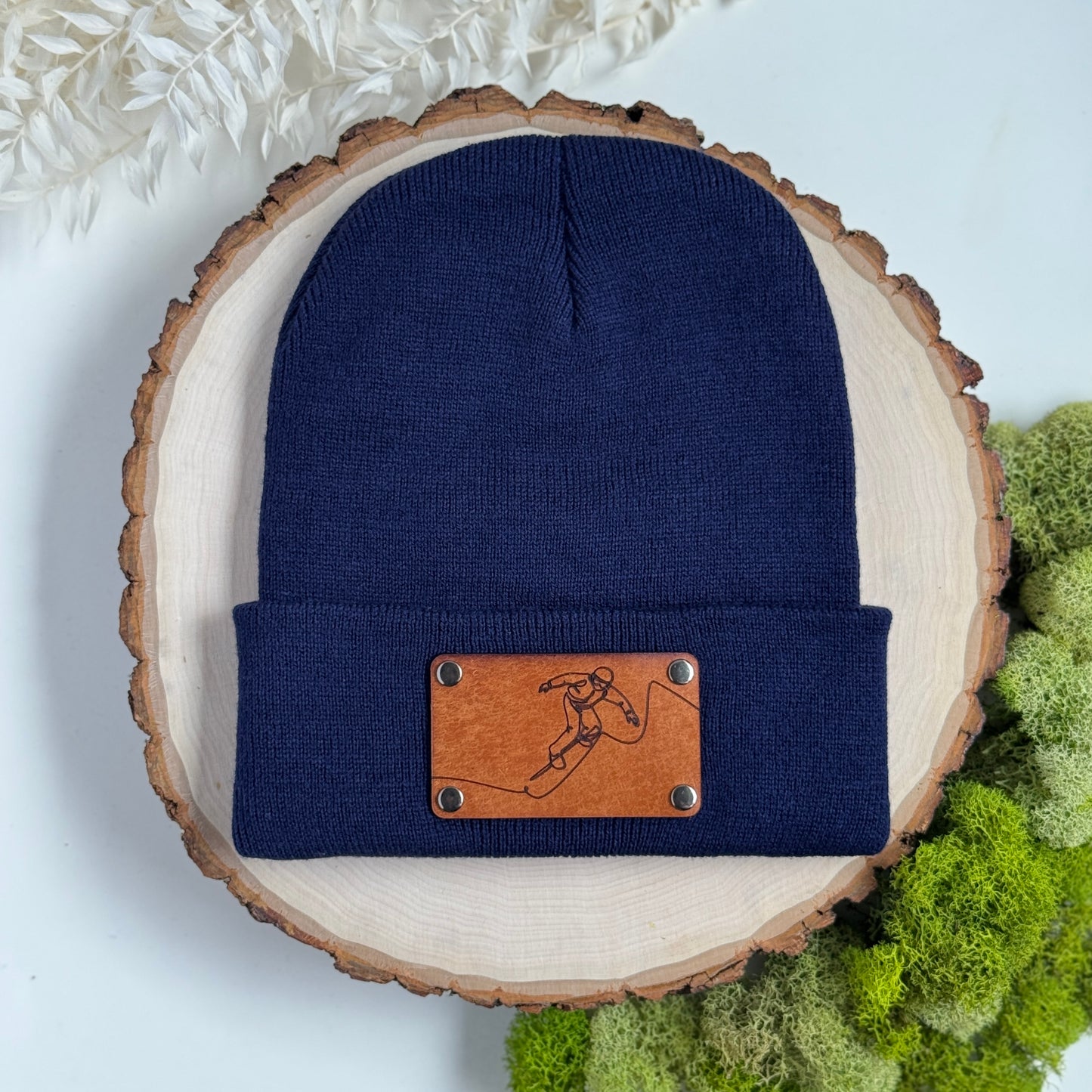 Snowboarder beanie with snap on/off leather patch