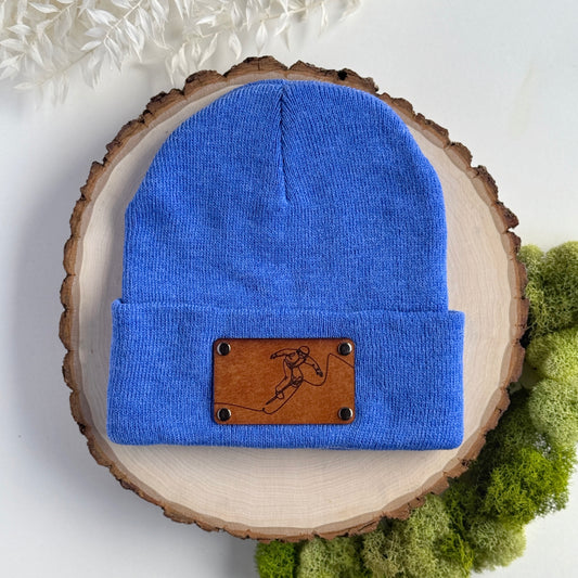 Snowboarder beanie with snap on/off leather patch