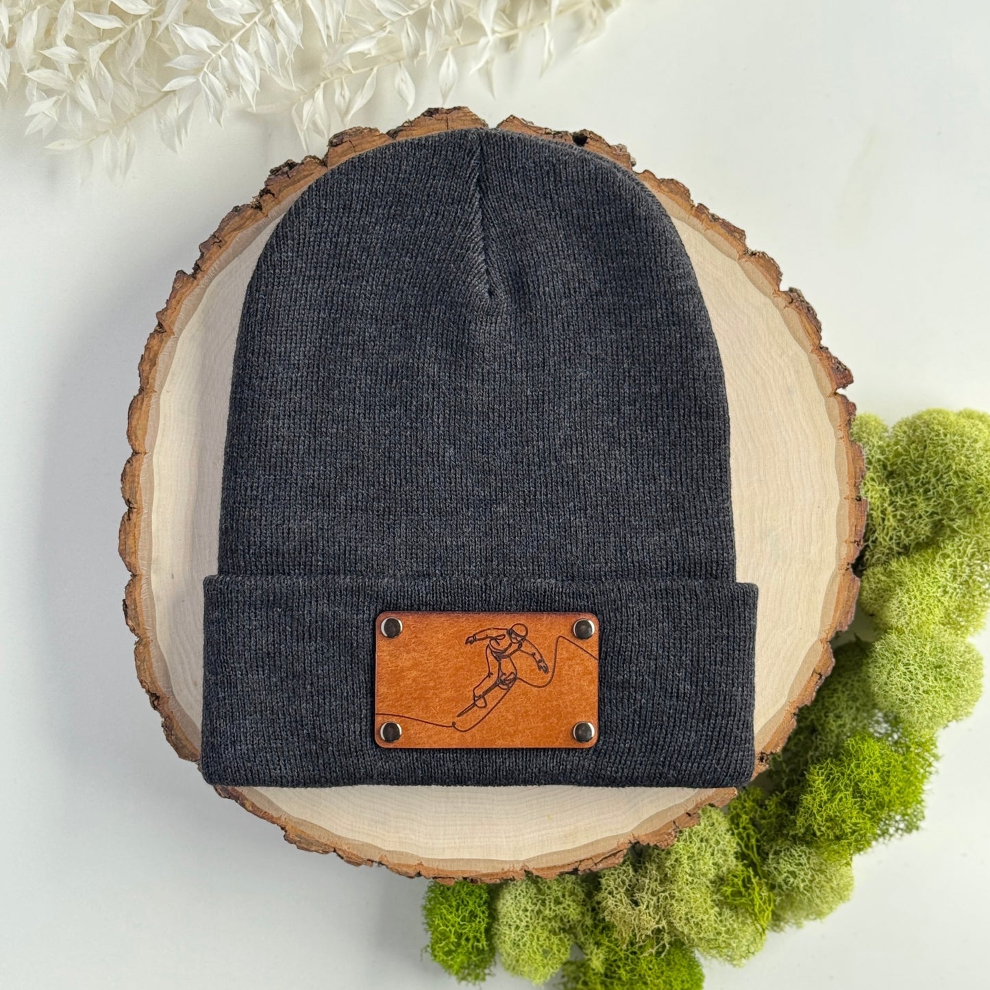 Snowboarder beanie with snap on/off leather patch