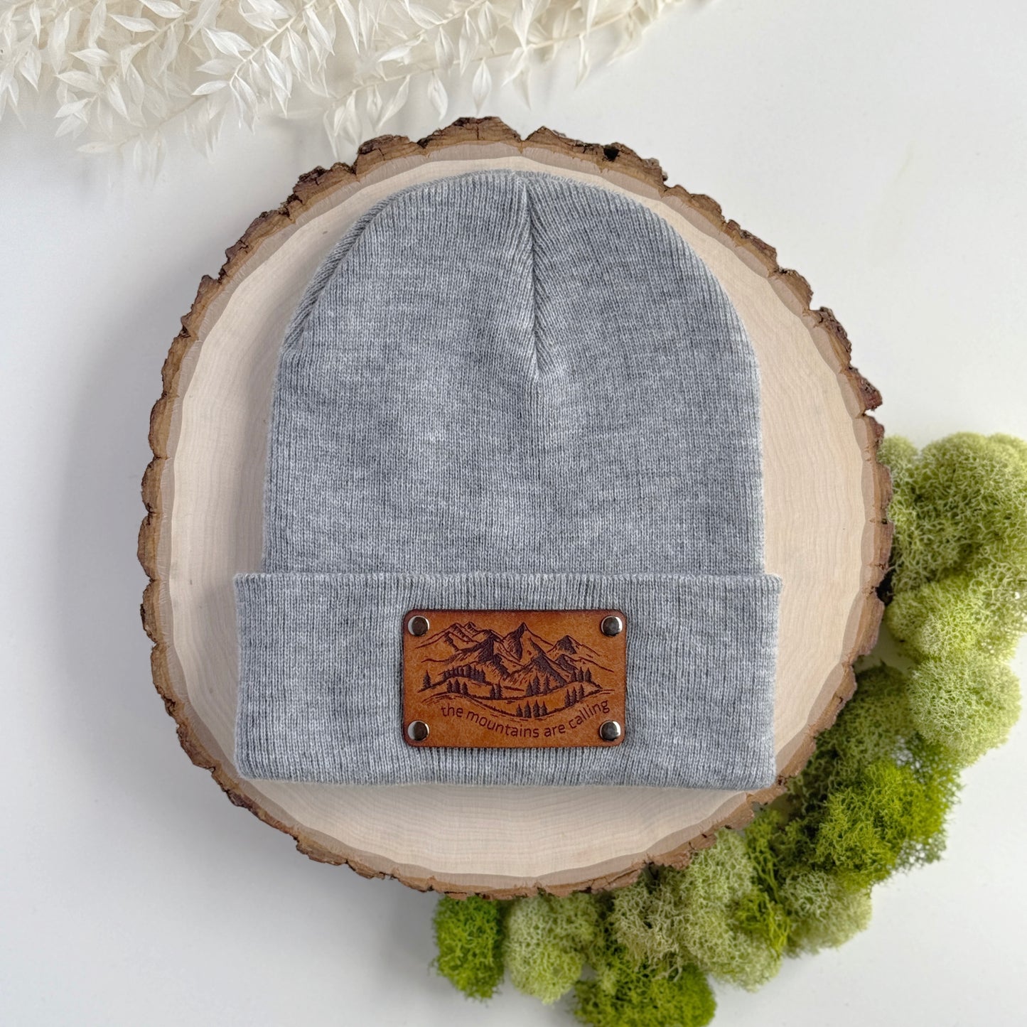 The Mountains Are Calling beanie with snap on/off leather patch