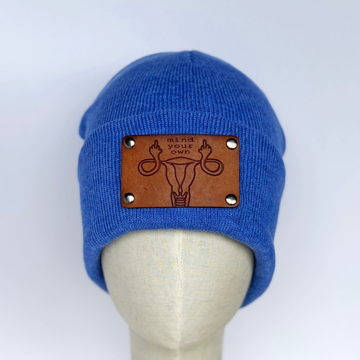 Mind Your Own Uterus beanie with snap on/off leather patch