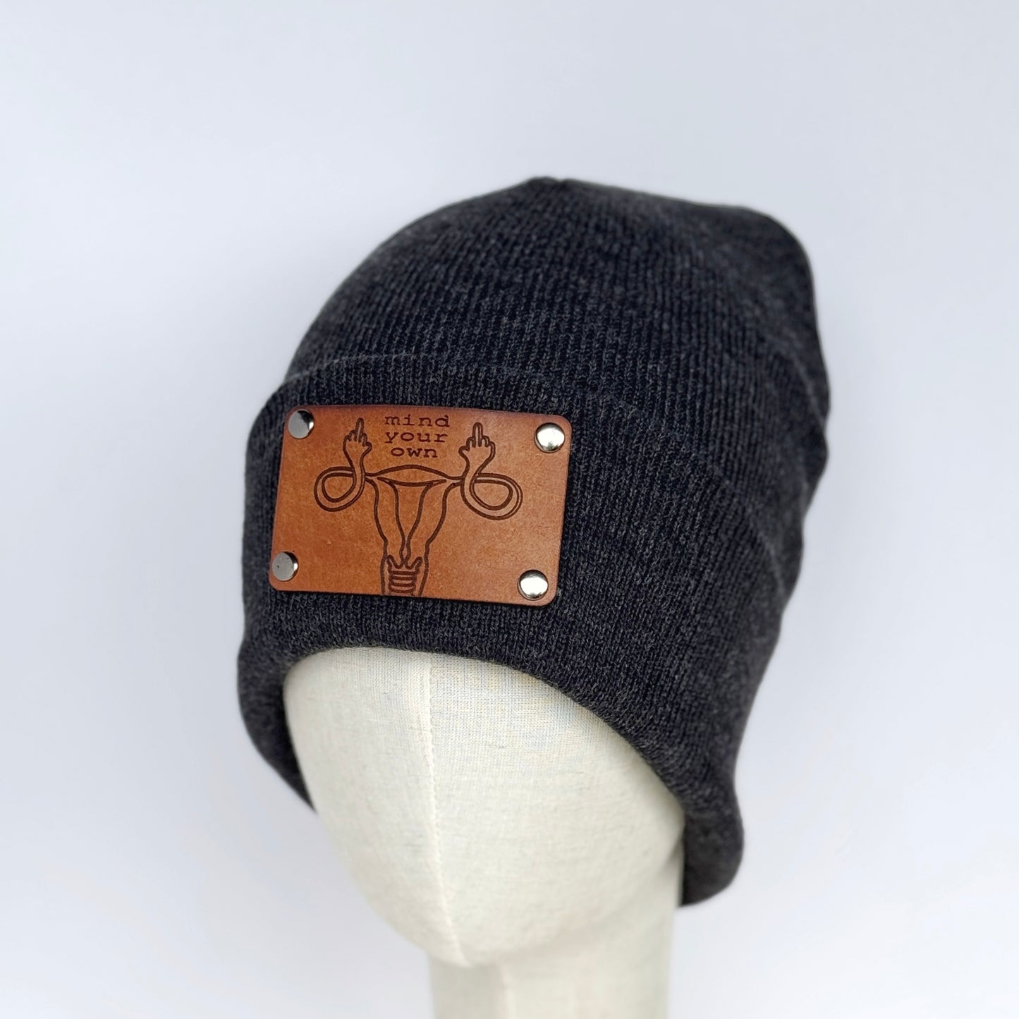 Mind Your Own Uterus beanie with snap on/off leather patch